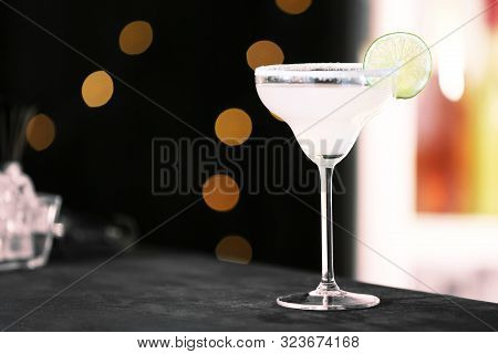 Fresh Alcoholic Cocktail With Lemon And Sugar On Bar Counter, Space For Text