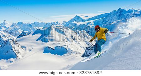 Skiing with amazing view of swiss famous mountains in beautiful winter snow  Mt Fort. The matterhorn and the Dent d'Herens. In the foreground the Grand Desert glacier.