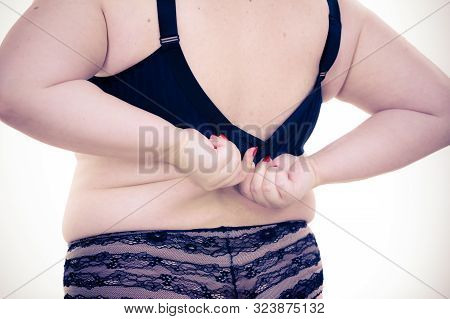 Fat Woman Rear View Opening Taking Off Or Putting On Her Bra. Plus Size Overweight Female Model Wear