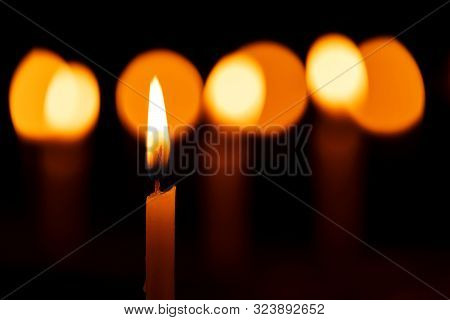 Selective Focus Of A Beautiful Candle Lit During Diwali Festival With Other Candles Creating Light B