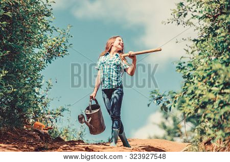Gardening Guide For Beginners. Gardening Tips. Spring Gardening. Girl Child Hold Shovel Watering Can