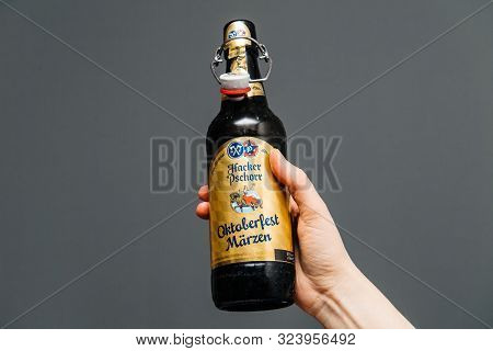 Muich, Germany - Mar 3, 2019: Man Hand Holding Drinking Open Bottle Of Traditional Oktoberfest Marze