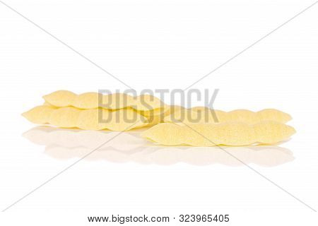 Lot Of Whole Uncooked Pasta Cavatelli Isolated On White Background