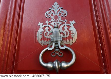 European Vintage Old Metal Wrought Iron Door Knocker. Design Detail. Paris.