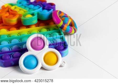 Anti-stress Toys Pop It, Simple Dimple, Snapperz On White Background, Copy Space. Concept Trendy Ent