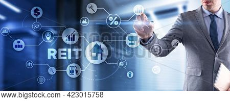 Reit. Real Estate Investment Trust. Financial Market. Hand Pressing Button On Screen