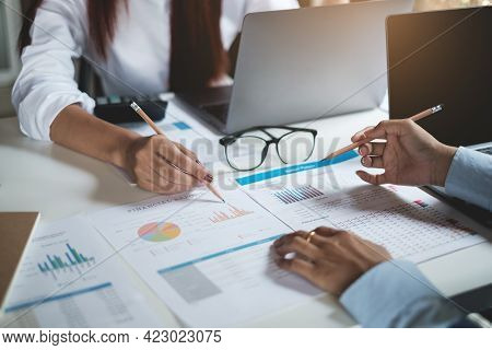 Group Of Businesswoman And Accountant Checking Data Document On Paperwork For Investigation Of Corru