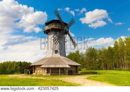 Wooden Windmill On Background Sky With Clouds. Naroch Lake, Myadel Region, Belarus
