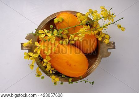 Golden Shower Flower And Yellow Cucumberarranged In A Brass Traditional Vessel Or Urule Placed On Th