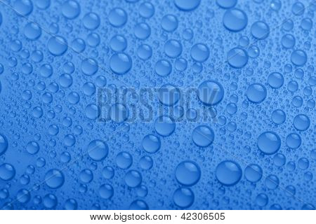 Water Drops On Blue Background