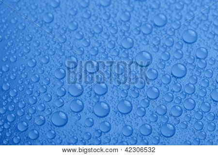 Water Drops On Blue Background