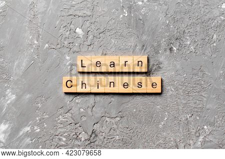 Learn Chinese Word Written On Wood Block. Learn Chinese Text On Table, Concept