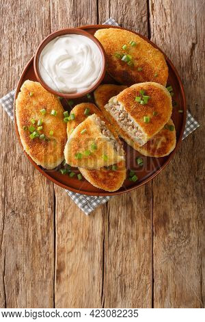 Tasty Potato Zrazy Ukraine National Cuisine Close-up In A Plate On The Table. Vertical Top View From