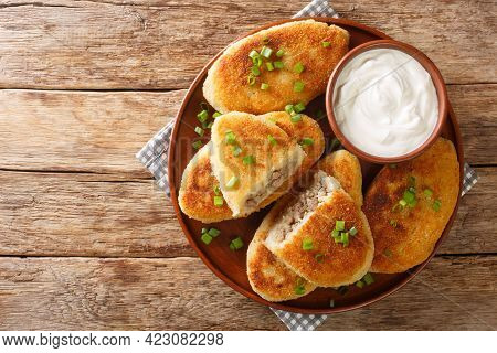 Traditional Ukrainian Cuisine Tasty Potato Zrazy With Meat Close-up In A Plate On The Table. Horizon