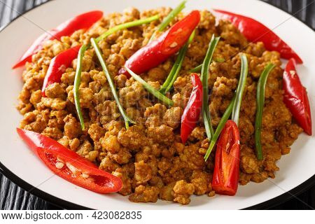 Southern Thai Khua Kling Pork Curry Close Up In The Plate On The Table. Horizontal