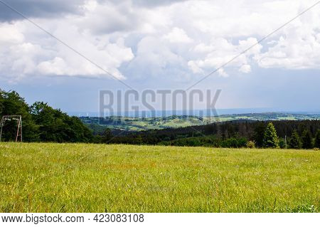 Landscape On Hoherodskopf, Volcano Region In Hesse, Germany. On Cloudy Sunny Warm Summer Day, Meadow