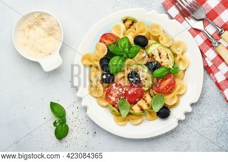 Pasta Fiocchi Salad With Vegetables Grilled Zucchini, Cherry Tomato, Olives, Basil And Parmesan Chee
