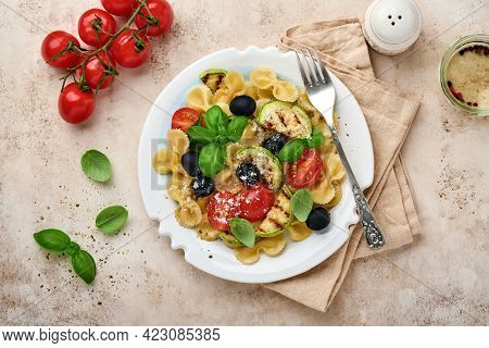 Pasta Fiocchi Salad With Vegetables Grilled Zucchini, Cherry Tomato, Olives, Basil And Parmesan Chee