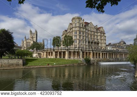 Bath, United Kingdom - June 8, 2021: Historic Buildings Line The River Avon As It Passes Through The