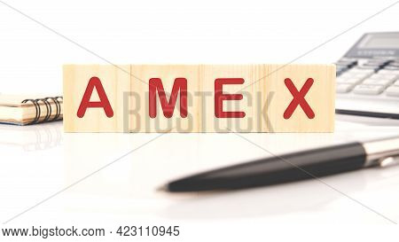 Wooden Cubes And The Word Amex, The Concept Of Taxation Of The Need To Increase Or Decrease Taxes.