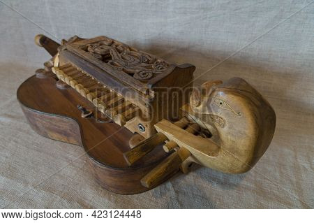 Wooden Medieval Musical Instrument Hurdy-gurdy With Guitar-shaped Body, Carved Decor On The Keyboard