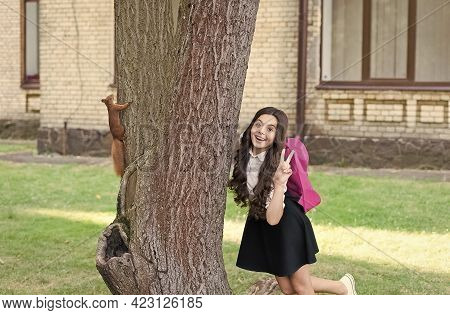 Passionate About Studying Zoology. Happy Child Show Peace Sign. Red Squirrel Climb Tree Trunk. Anima