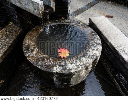 Stone Water Basin With Red Maple Leaf In Historic Downtown Of Kiso-fukushima - Nagano Prefecture, Ja