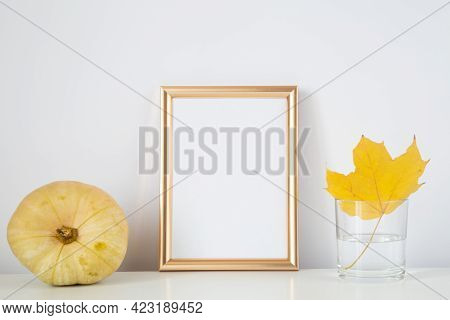 Autumn Frame, Background. Thanksgiving Mockup With Golden Frame And Yellow Leaf And Pumpkin. Hallowe
