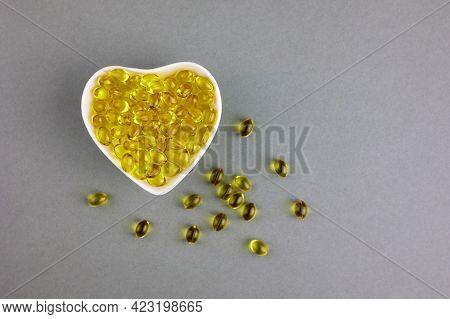 Capsules With Vitamin D3. The Concept Of Health And Medicine, The Vitamin Of Sunlight.