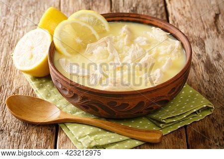 Homemade Greek Chicken, Rice And Lemon Soup Kotosoupa Avgolemono Close-up In A Bowl On The Table. Ho