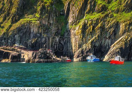 Boats Docking To Per On Skellig Michael Island, Tourists On And Of Boarding. Star Wars Film Location