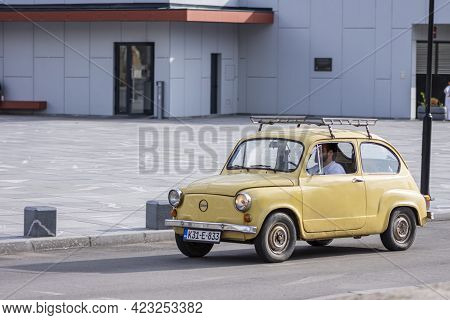 Old Timer Car Zastava Fiat 500 On Street With Driver Inside Passing On Street In Sarajevo, Bosnia An
