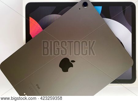 Grodno, Belarus - 06.12.2021: The Ipad Air 2020 Tablet In Black Color Lies On A Branded Box On A Whi