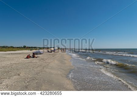 Corbu, Constanta, Romania - August 01, 2020: Tourist Having Fun On The Beach Of Corbu, Romania.