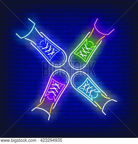 Four Feet Standing In Circle Neon Sign. Friendship, Unity, Advertisement Design. Night Bright Neon S