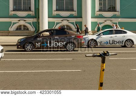 St. Petersburg, Russia, June 4, 2021: Brown And White Car With An Application On The Order Of An Ube