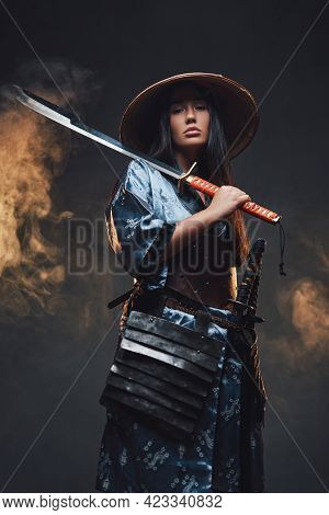 Asian Woman With Katana And Kasa Against Smokey Background