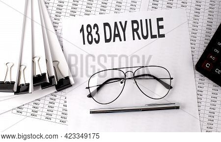183 Day Rule Text On The Paper With Chart And Office Tools , Business