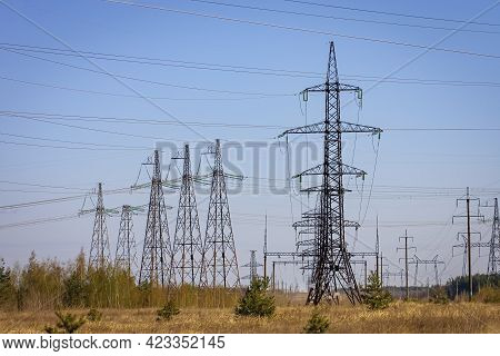 High Voltage Power Line On Industrial Electricity Line Tower. Energy Transmisson With Overhead Power
