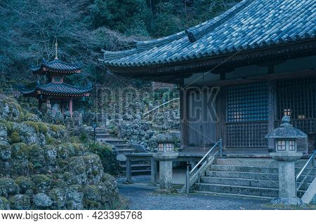 Evening Near Historic Buddhist Temple. Hundreds Of Stone Statues In The Garden. Buddhist Shrine In O