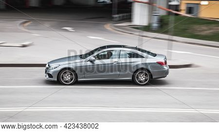 Moscow , Russia - May 2021: Gray Mercedes E Class C207 Car Driving Fast On The Open Road