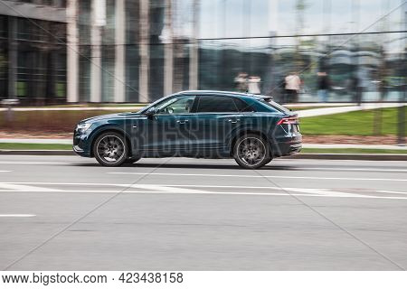 Moscow, Russia - June 2021: Audi Q8 Car Driving In City With Motion Blur, View From The Side