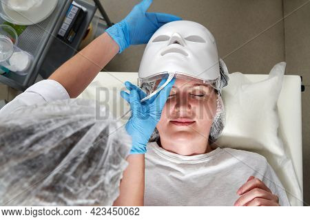 Photon Mask. Health And Beauty. Cosmetic Procedure For Woman Face. Beauty Laboratory. Led Facial Mas