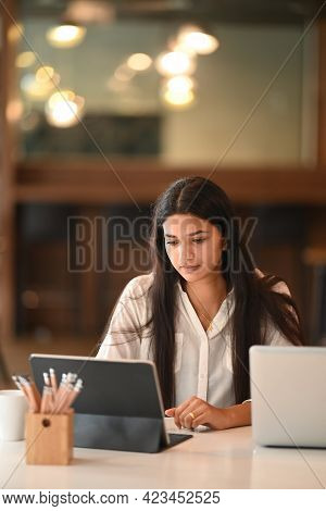 Portrait Of Businesswoman Working On Her Project With Digital Tablet In Moern Office.