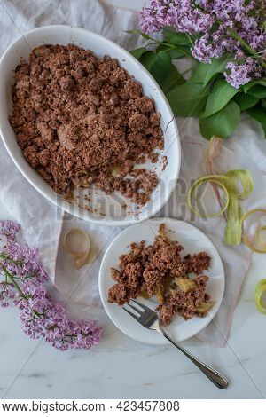 Sweet Home Made Chocolate Rhubarb Crumble With Lilach Flowers