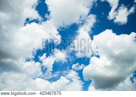 Beautiful White Cumulus And Cirrus Clouds On Blue Sky In Spring Close Up. Sky And Cloud.