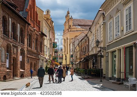 Vilnius, Lithuania - May 8, 2021: Tourists Walk On Pilies Street, The Oldest And Most Flamboyant Str