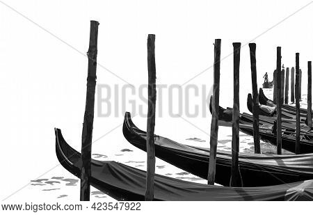 The Gondolas Are At The Pier Covered With Cloth. A Boat Is Sailing In The Distance, Driven By A Gond