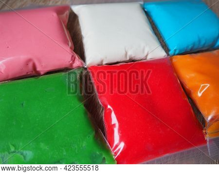 Colorful Kid S Plasticine On White Background, Colorful Dough Modeling Clay. Packing Of Colored Soft