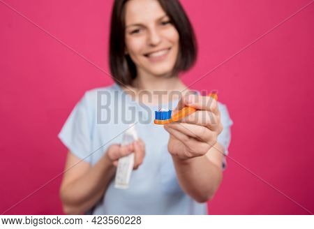 Beautiful Happy Young Woman With Toothbrush On Blank Pink Background